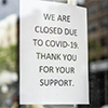 Closed Due to COVID sign; source: Michael Lee, Getty Images