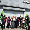 Councilmember Curren Price and community members celebrate the opening of the new BusinessSource Center on Central Avenue. (Courtesy photo)