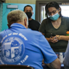 Maria Velasquez, who was displaced along with her family by Wednesday’s explosion, visits a newly opened assistance center.(Irfan Khan / Los Angeles Times)