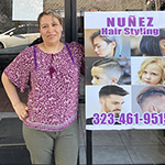 Concepcion Nuñez, owner of Nuñez Hair Styling in Hollywood, standing ouside her business